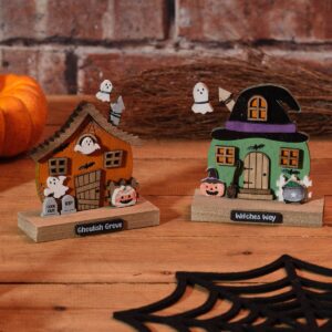 Wooden Halloween house block ornament with ghost and bat decorations, available in green with a witch hat roof or orange with pumpkins and tombstones, measuring 10.5 x 4.3 x 11 cm.