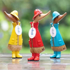 Hand-carved DCUK Rainy Day Ducklings decorative bamboo duck ornaments, individually painted colourful collectible figures in yellow, red, blue, green and pink, each approx. 22cm tall.