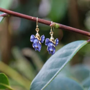 Gold plated iris drop hook earrings with hand-finished blue enamel flower design, elegant botanical jewellery with hypoallergenic hooks, ideal for pairing with the matching Gold Plated Iris Pendant Necklace.