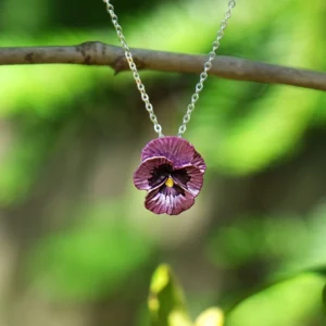 Silver plated pink pansy pendant necklace with hand enamel floral design, delicate botanical jewellery piece with adjustable chain and pink flower detail.