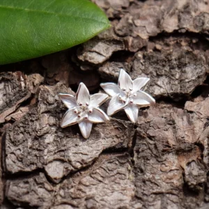 Silver plated white lily stud earrings with white hand enamel floral design, botanical flower jewellery with hypoallergenic posts, ideal for pairing with the matching pendant necklace.