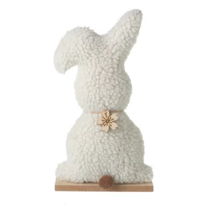 White fluffy bunny rabbit ornament with soft textured fur, wooden flower decoration, brown pom-pom tail, and wooden base, ideal for Easter and spring home decor.