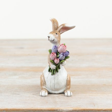 Rustic bunny holding flowers ornament featuring a standing rabbit with a colourful tulip bouquet in pink and purple, ideal for Easter and spring decor.