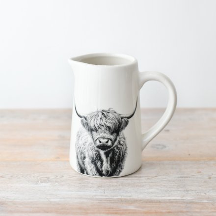 Ceramic Highland Cow Jug with countryside cow illustration on white background, styled for farmhouse kitchen decor and display.
