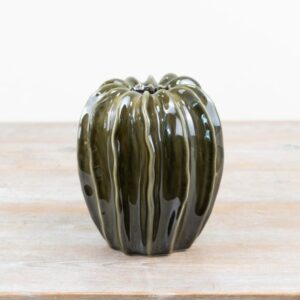 Emerald green glazed ceramic pod-shaped vase, ideal for modern home décor and floral arrangements, styled as a decorative accent piece.