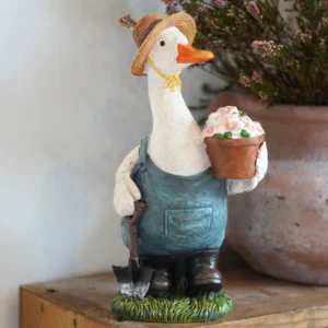 Hand-painted Madam Duck Jemima resin garden ornament, weatherproof duck statue with classic countryside charm for indoor and outdoor home and garden decor.