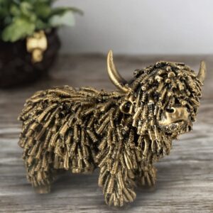 Shaggy golden Highland cow ornament figurine with textured coat and antique gold finish rustic home decor sculpture for shelf mantel or desk display