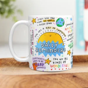 Colourful inspirational “Daily Reminders” mug featuring a smiling sun, positive affirmations, and hand-drawn doodles including stars and the earth.