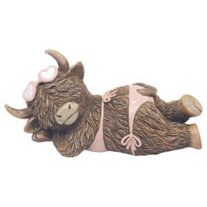 Highland Cow relaxing on a beach in pink swim suit ornament for home decor