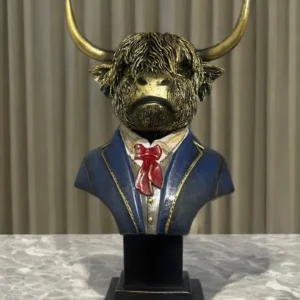 Highland cow bust ornament featuring a shaggy-haired cow wearing a tailored jacket and bow tie, designed as a quirky rustic home décor figurine.