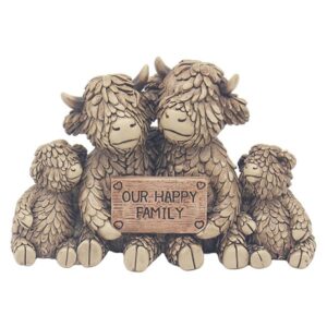 Highland cow family ornament featuring two adult cows and two calves holding an "Our Happy Family" sign, styled as rustic farmhouse home decor.