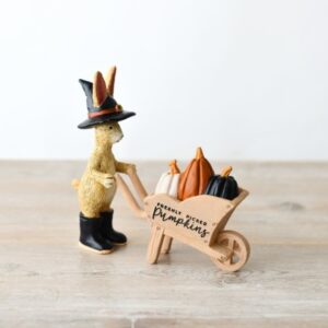 Jasper Bunny wizard ornament featuring a rabbit in wizard attire pushing a wheelbarrow filled with pumpkins, styled as whimsical autumn home décor.