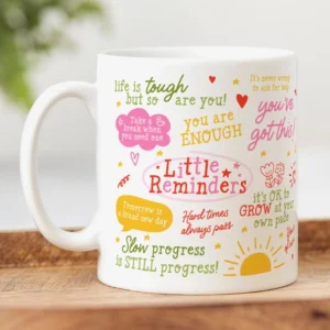 Pastel “Little Reminders” affirmation mug featuring positive self-care quotes, hearts, stars, and uplifting typography designed for daily inspiration.