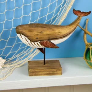 20cm rusty whale ornament on a stand featuring a natural wood-effect body, distressed red fins and tail, and rustic coastal nautical décor styling.