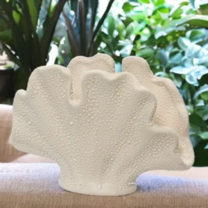 Sea shell ceramic planter with fan-shaped shell design, raised coral-inspired textures, and sandy-toned finish, perfect for coastal home décor and small plants.