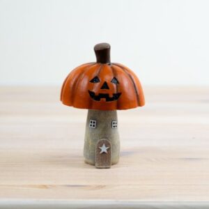 Halloween pumpkin roof house ornament featuring a spooky haunted house design, perfect for autumn and seasonal home decor displays.