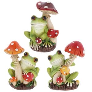 Medium frog ornament sitting under a red spotted mushroom with woodland garden details