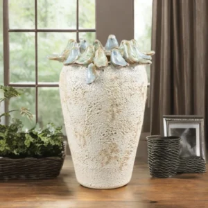 Stone decorative vase with glazed bird details around the top, ideal for rustic home décor and displaying flowers.