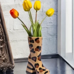 Leopard print heeled boot ceramic vase with glossy finish in caramel, brown, and black tones, styled as a decorative home decor accent piece.