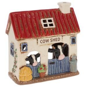 Village Pottery ceramic cowshed tealight holder with red roof, cows, blue stable doors and rustic farmhouse details.