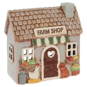 Village Pottery ceramic Farm Shop tealight holder with a cat, hen, baskets of fruit and vegetables, and rustic farmhouse details.