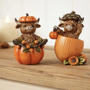 Autumn Highland cow resin ornaments wearing pumpkin and acorn hats with cosy seasonal accessories, perfect for autumn and harvest home decor.