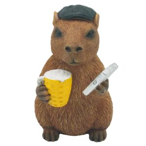 Happy Capybara Cheeky Chap resin ornament wearing a black hat and holding a glass of beer and a mobile phone.
