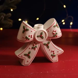 Merry Little Bows white stoneware Christmas bow candle holder with holly and candy cane decorations