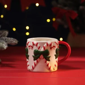 Merry Little Bows embossed Christmas ceramic mug with red candy canes, green bows and red handle