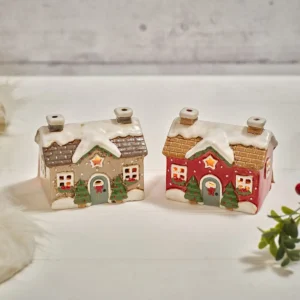 Holly Cottage set of 2 stoneware Christmas house candle holders with cut-out stars and snowy details