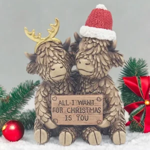 Highland cow Christmas ornament with “All I Want for Christmas Is You” message, festive holiday decoration.