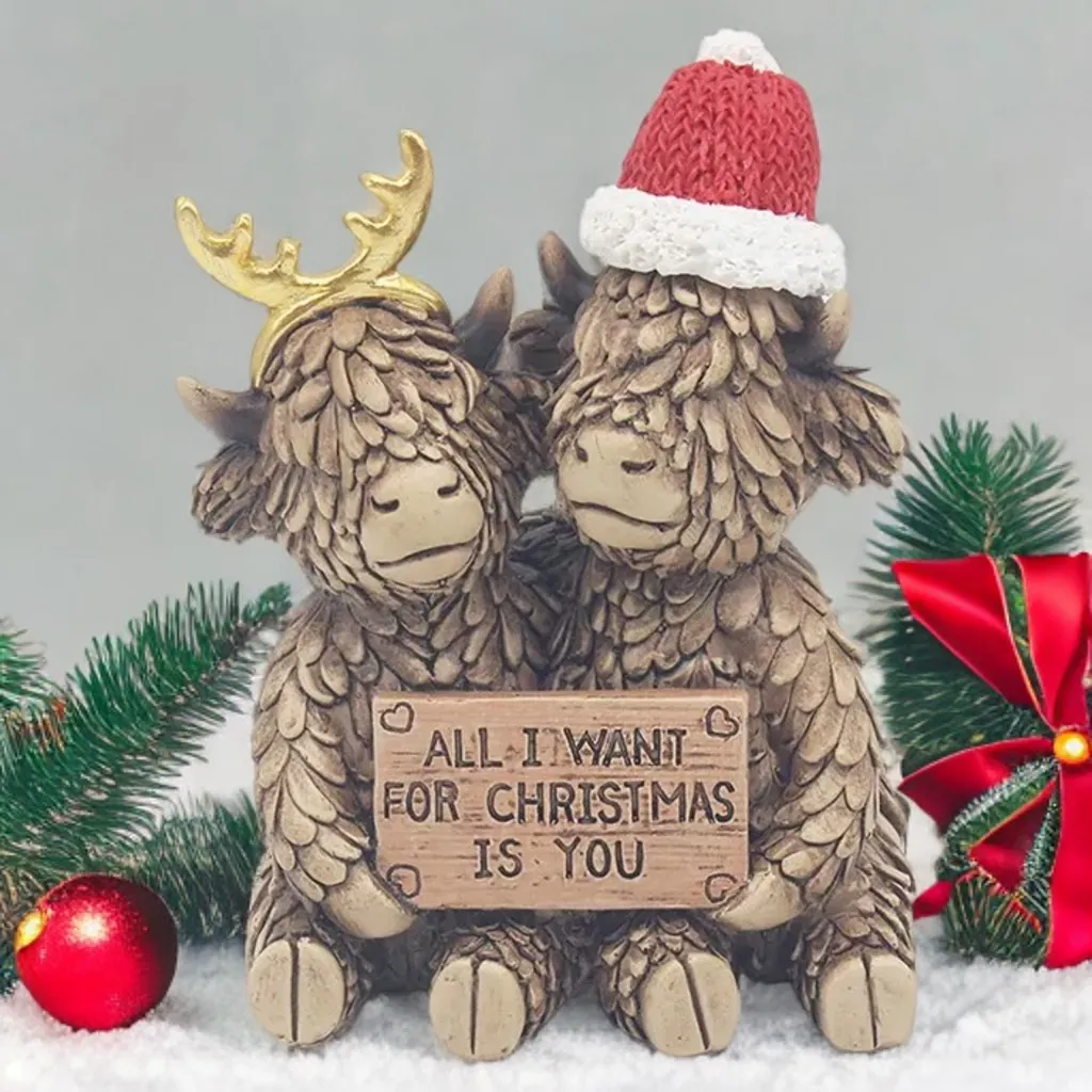Highland cow Christmas ornament with “All I Want for Christmas Is You” message, festive holiday decoration.
