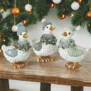 Christmas duck decorations with festive garlands, seasonal ornaments for Christmas home decor.