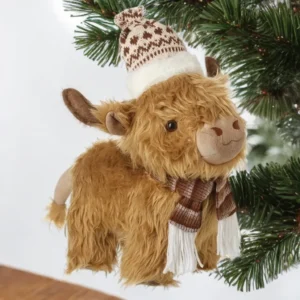 Christmas Highland cow ornament wearing a knitted brown and white hat and scarf, festive holiday decoration.